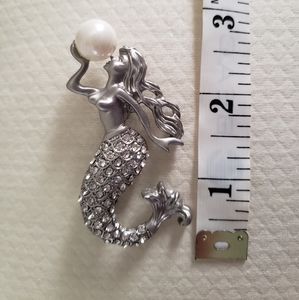 Mermaid with pearl brooch